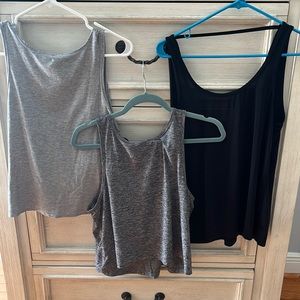 Three Beyond Yoga Tank Tops, two gray, one black. Size small/medium